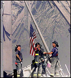 Firefighters raise the flag at WTC